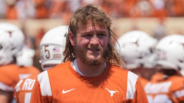 Texas quarterback Quinn Ewers walks to the medical tent during the fourth quarter of the loss to Alabama on Sept. 10, 2022.